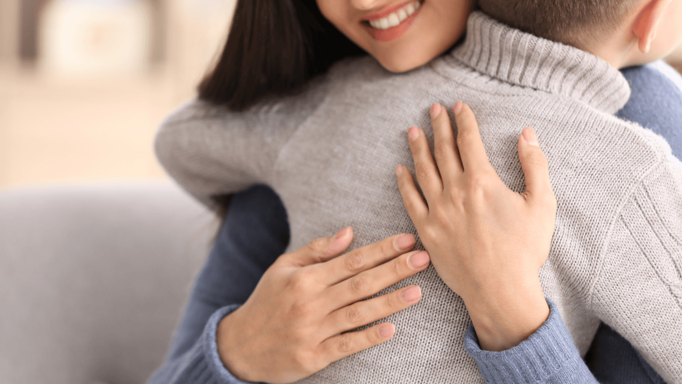Woman hugging child no faces